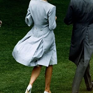 Princess Diana attends the Ascot races. She is wearing a pearl grey silk top coat