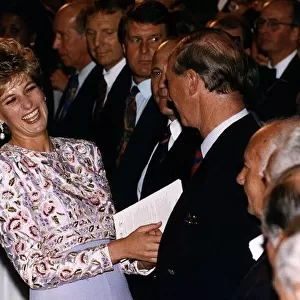 Princess Diana laughing with Prince Charles after meeting members of England