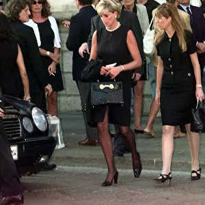 Princess Diana leaves a memorial service for slain Italian fashion designer Gianni