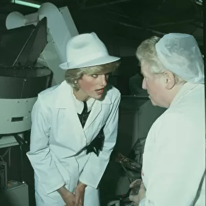 Princess Diana (left) dressed in a white factory coat and hat tours the Keiller Marmalade