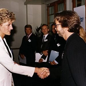 Princess Diana meets musician and singer Eric Clapton Rock at the charity film premiere