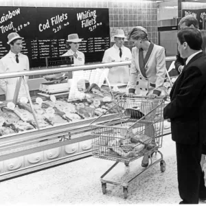 Princess Diana, The Princess of Wales, takes a shopping trolley around Tesco at Southport