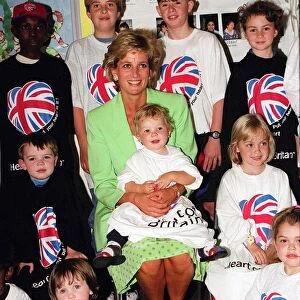 Princess Diana Princess of Wales with James Perry sitting on her knee during a visit to a