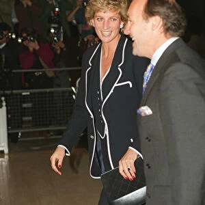 PRINCESS DIANA, SMILING, AND AN UNKNOWN MAN ARRIVE AT A FUNCTION - 05 / 06 / 1995