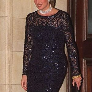 Princess Diana, wearing a black lace dress, leaves the Royal Albert Hall after attending