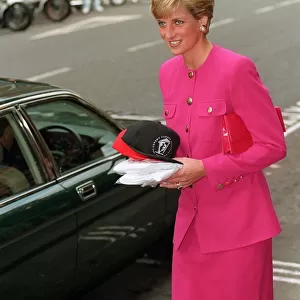 Princess Diana, wearing a pink jacket and skirt, visits the Theatre Museum in Covent