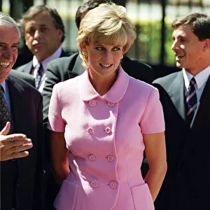 PRINCESS DIANA, WEARING PINK SUIT AND SMILING, GREETING PEOPLE ON HER TRIP TO ARGENTINA