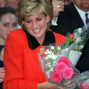 PRINCESS DIANA WEARS A RED SUIT, SMILES AND CARRIES FLOWERS DURING A VISIT TO THE ENGLISH PRINCESS DIANA WEARS A RED SUIT, SMILES AND CARRIES FLOWERS DURING A VISIT TO THE ENGLISH