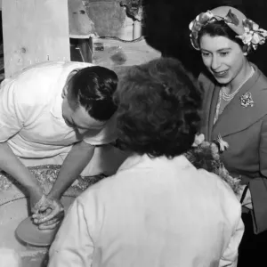 Princess Elizabeth (later Queen Elizabeth II) speaks to Mrs Cyples (back to camera Princess Elizabeth (later Queen Elizabeth II) speaks to Mrs Cyples (back to camera