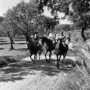 Princess Margaret visits Portugal. The Princess riding through the groves of Count Nova