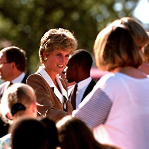 PRINCESS OF WALES GREETING PEOPLE DURING A VISIT TO RED CROSS CHARITY PROJECT IN ZIMBABWE