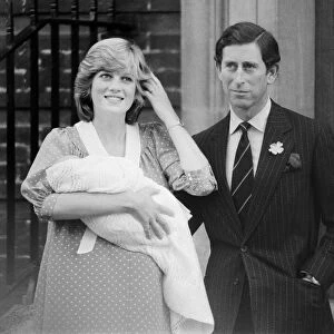 Princess of Wales holds her new born baby son William and Prince Charles at St. Marys Hospital