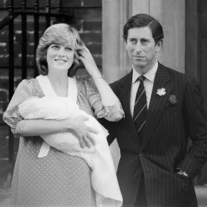 Princess of Wales holds her new born baby son William and Prince Charles at St. Marys Hospital