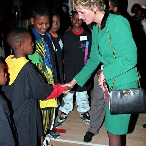 PRINCESS OF WALES IN SOUTHWARK - F / L, SMILING WEARING GREEN SUITS AS SHE TALKS TO A GROUP