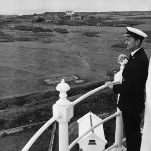 Principal Keeper Colin Nicholls admires the view from the top of the Flat Holm Lighthouse