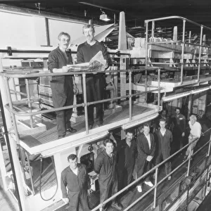 Printers of the Herald Express in 1991 with the press which used to roll up to seven