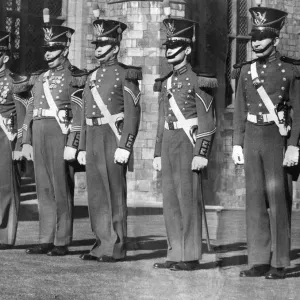 Private First Class James M. Kelly (left) wearing the historic uniform of the famous