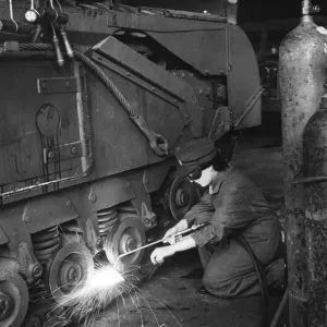 Private Mary Lynn wielding a Churchill tank in an Ordnance Depot Private Mary Lynn wielding a Churchill tank in an Ordnance Depot