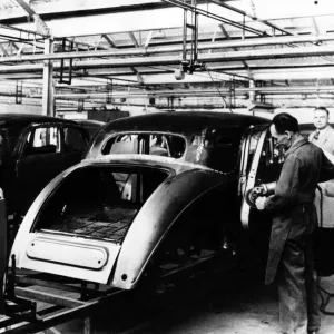 Production of Riley saloons in the late 1940s. Skilled tradesmen are seen fettling Production of Riley saloons in the late 1940s. Skilled tradesmen are seen fettling