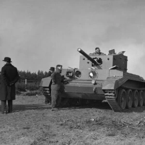 A prototype Cromwell tank is put through its pace for King George VI