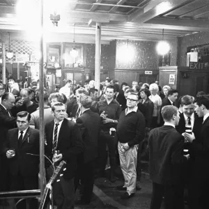 Pub goers awaiting the cabaret at a pub in Londons East End on a Saturday night Pub goers awaiting the cabaret at a pub in Londons East End on a Saturday night