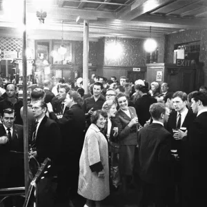 Pub goers awaiting the cabaret at a pub in Londons East End on a Saturday night Pub goers awaiting the cabaret at a pub in Londons East End on a Saturday night