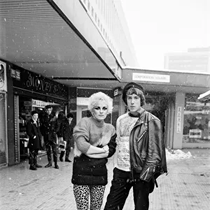 Punk Rock fashions in Birmingham. A young woman and man standing outside in a shopping