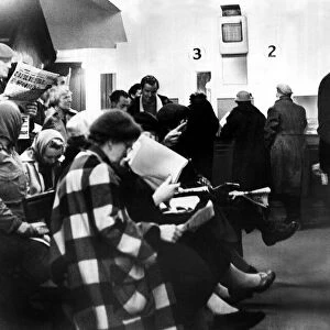 Punters placing their bets at the betting shop May 1958