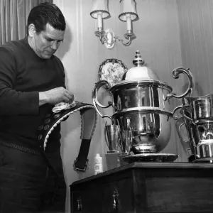 Putting a shine on one of his trophies is British wrestler Count Bartelli in his Crewe Putting a shine on one of his trophies is British wrestler Count Bartelli in his Crewe