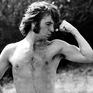 Q. P. R. star Stan Bowles shows of his muscles during Queens Park Rangers team training