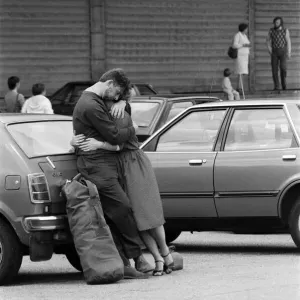 QE2 returns home to Southampton. Union Jacks are festooned on cars, draped on shoulders QE2 returns home to Southampton. Union Jacks are festooned on cars, draped on shoulders