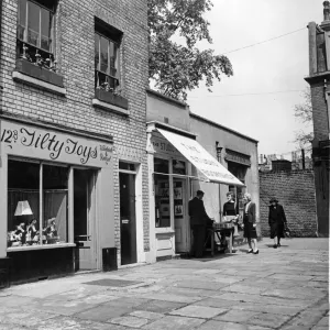 Print of a quaint London street scene, circa 1955