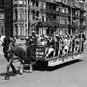 The quaint old world. "Toast Rack"horse trams are carrying thousands daily