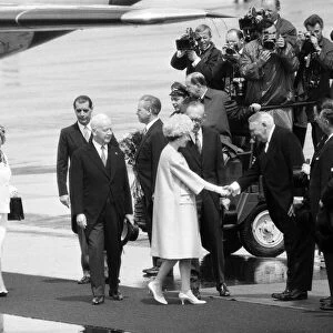 The Queen arriving at Cologne Airport, West Germany, shaking hands with Chancellor Erhard