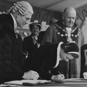 The Queen autographing one of the Royal Portraits at Morecambe with the Mayor Bryce Clegg The Queen autographing one of the Royal Portraits at Morecambe with the Mayor Bryce Clegg