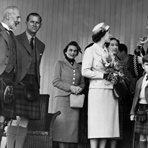 The Queen chats with Capt. A. C. Farquharson of Invercauld whilst the Marquess of Aberdeen