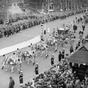 The Queen and the Duke of Edinburgh in the gold state coach in Northumberland Avenue as