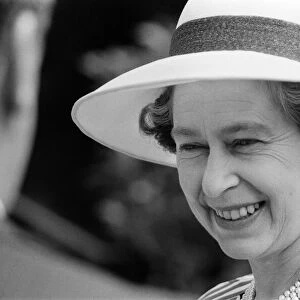 Queen Elizabeth II attends a garden party at Holland House Hostel to mark the Golden