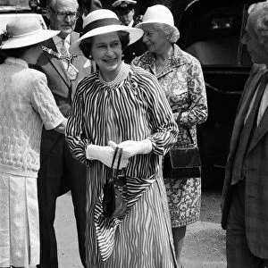 Queen Elizabeth II attends a garden party at Holland House Hostel to mark the Golden