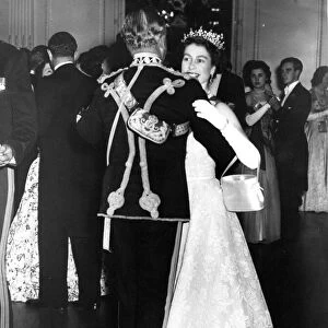 Queen Elizabeth II dances with Air Marshall Sir John Baldwin at the Light Brigade