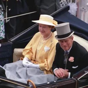 Queen Elizabeth II and The Duke Of Edinburgh, Prince Philip riding in a carriage during