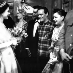 Queen Elizabeth II has a happy smile as she congratulates Judy Gardland on her Queen Elizabeth II has a happy smile as she congratulates Judy Gardland on her