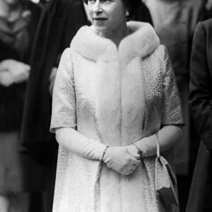 Queen Elizabeth II leaves St Giles in Scotland wears fur trimmed coat and tiara