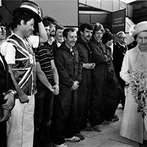 Queen Elizabeth II in Liverpool. The Queen walks past various member of Liverpool