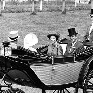 Queen Elizabeth II with Prince Philip driving up the course at Royal Ascot
