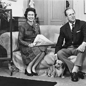 Queen Elizabeth II with Prince Philip and one of the family corgi