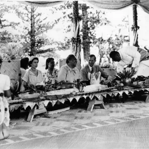 Queen Elizabeth II and Prince Philip with the Queen of Tonga at a feast at which a