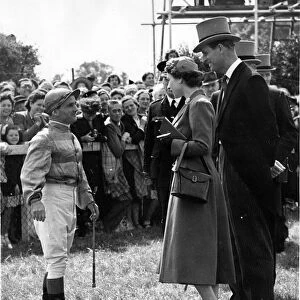 Queen Elizabeth II and Prince Philip talking with champion jockey, Gordon Richards