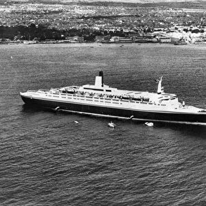The Queen Elizabeth II - QE2 ship - seen here of the coast of Barbados