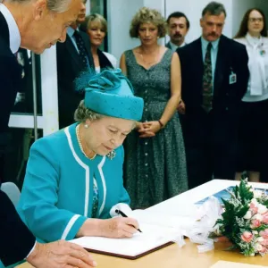 Queen Elizabeth II signs the visitors book at the British Council Offices, Manchester